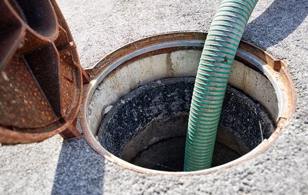 foul odors, slow draining sinks, and grease build-up in the trap are all signs that grease trap pumping services are needed